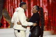 Ashanti and Nelly embrace on stage at the 2025 iHeartRadio Music Awards - Show - Source: Getty
